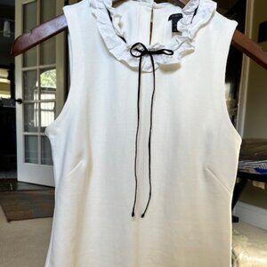 White sleeveless, ruffled collar blouse